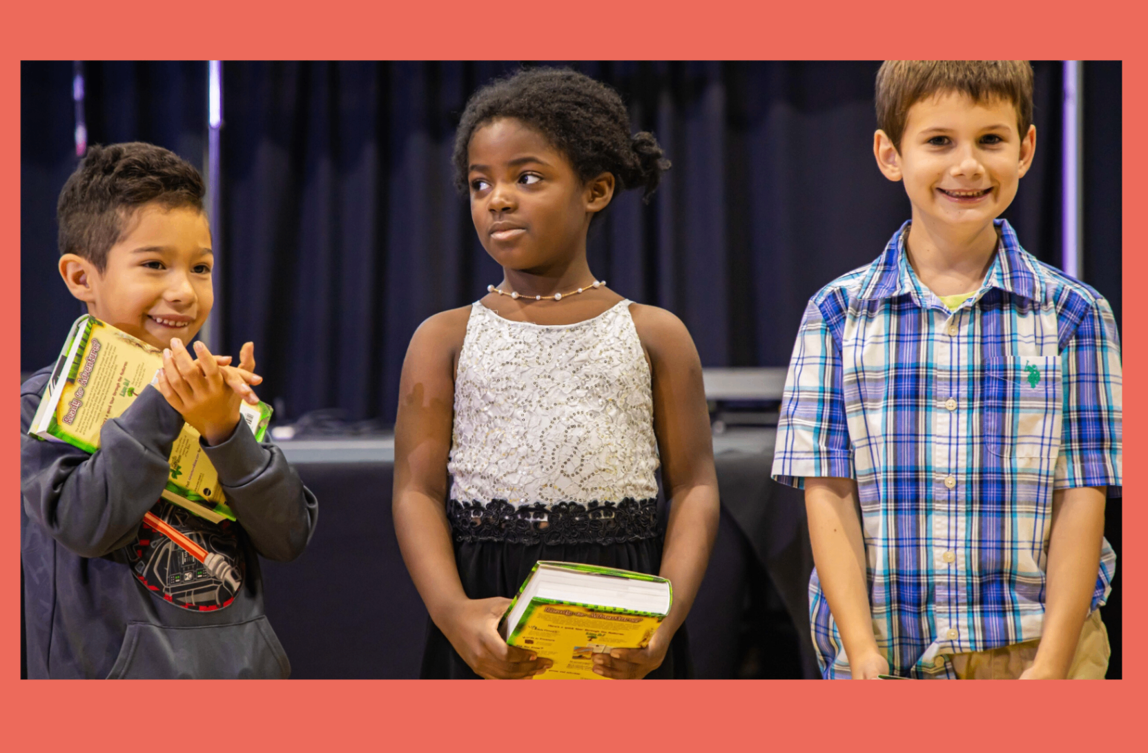 Children standing on a church stage during a ministry moment