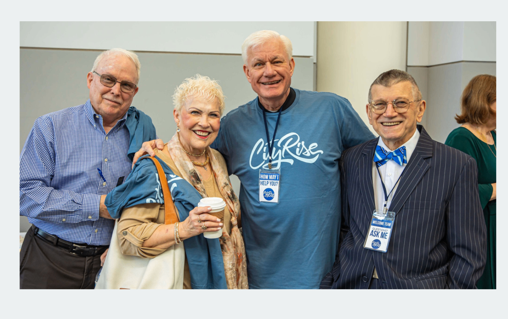 Older adults smiling together as a welcome team example